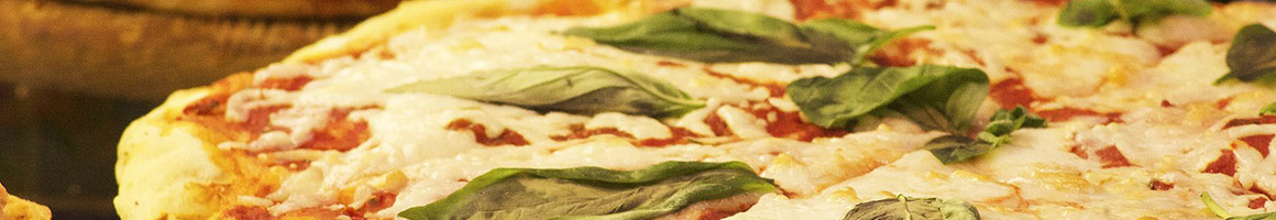 Eating Italian Pizza at Vinnys pizza and pasta restaurant in Newport News, VA.